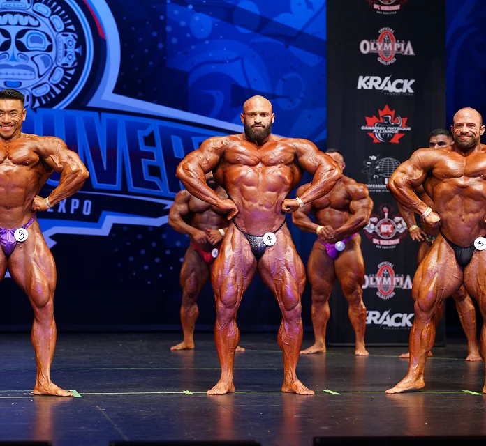 Bodybuilders on stage at a competitive event