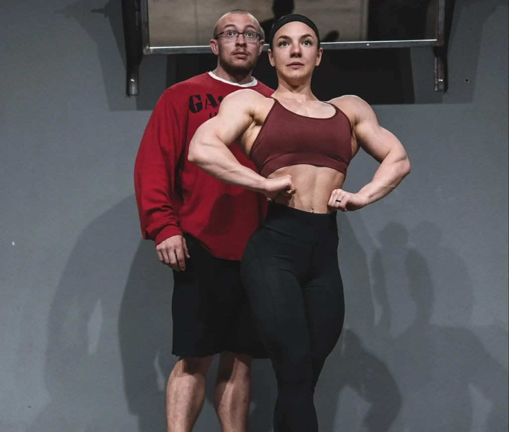 John Jewett coaching a female athlete